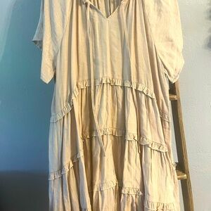 Tan tiered tie-front dress. Crepe-like material, thicker.